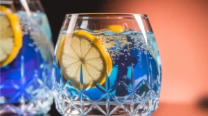 Blue Moon Mocktail with lemon wheels in an elegant glass