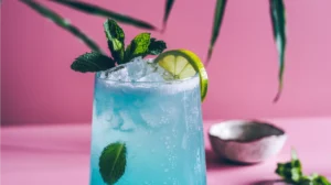 Minty Blue Refresher Mocktail with fresh mint and lime garnish