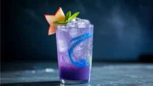 An elegant purple mocktail with subtle blue swirls and a shimmer effect, garnished with a star fruit slice and mint sprig over crushed ice