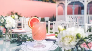 A zesty sparkling grapefruit mocktail with a fresh grapefruit slice garnish, served in a crystal clear glass