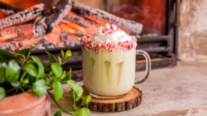 Creamy white chocolate peppermint mocktail with candy cane rim