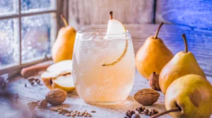 Delicate pear mocktail with fresh pear garnish and winter lighting